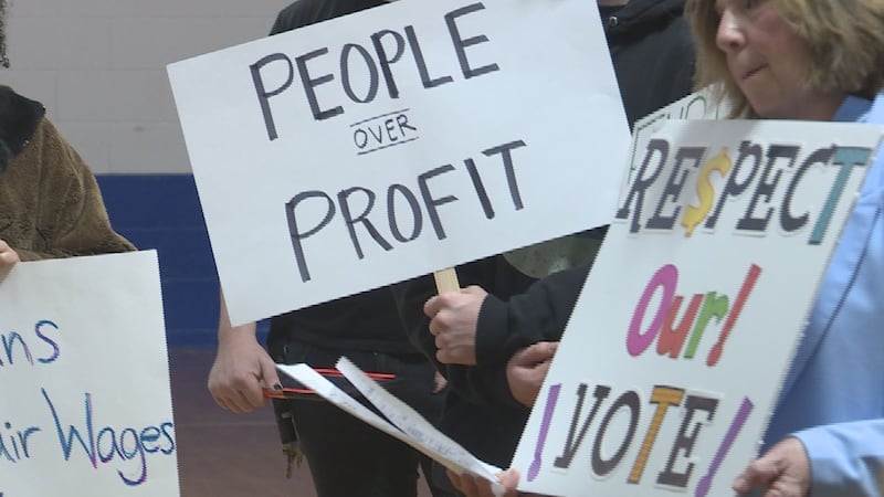 Dozens gathered for a rally against a minimum-wage-capping bill on Saturday.