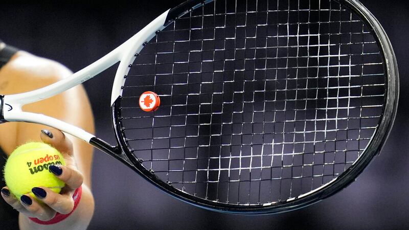 Canada's Bianca Andreescu's tennis racquet has a vibration damper with the Canadian flag on it...