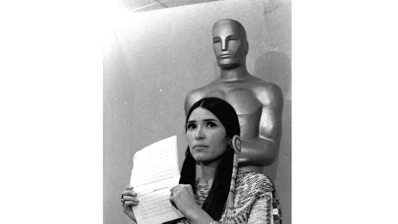 FILE - Sacheen Littlefeather appears at the Academy Awards ceremony to announce that Marlon...