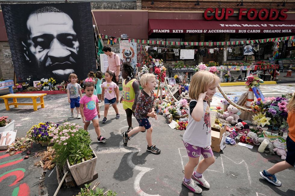 FILE - Preschool children visit the site where George Floyd was murdered by then Minneapolis...