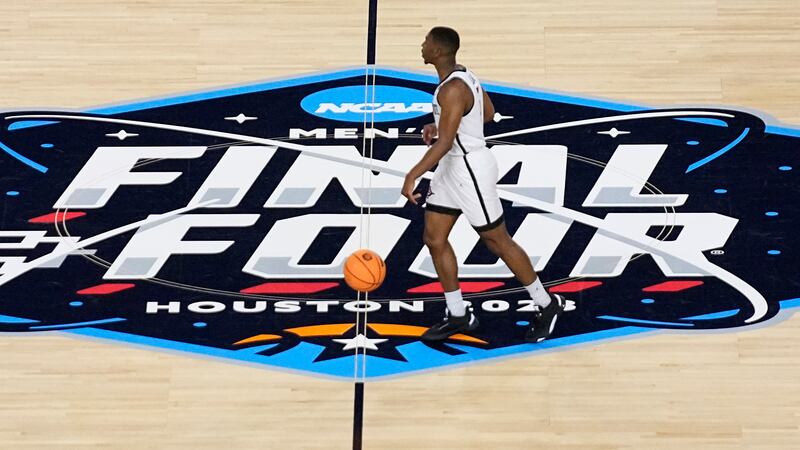 San Diego State guard Lamont Butler drives up court against Florida Atlantic during the first...