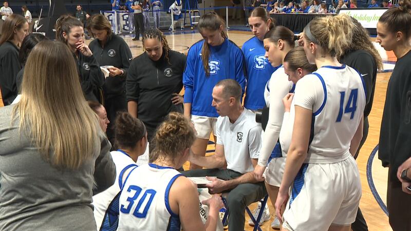 Jim Flanery draws up a play for Creighton women's basketball during a timeout.