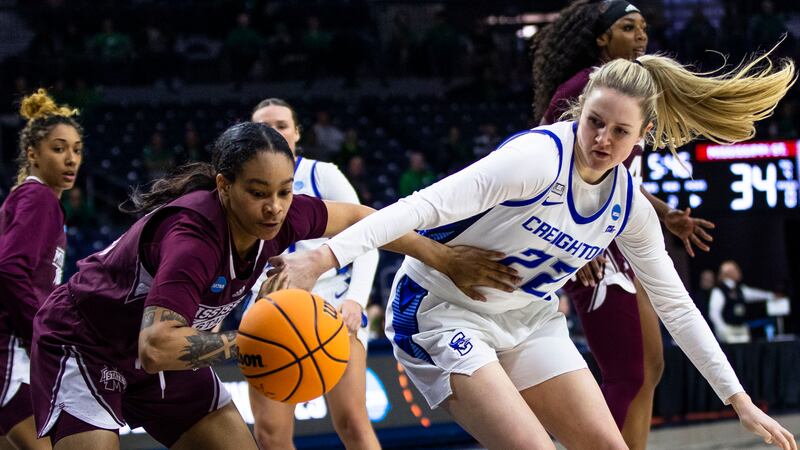 Mississippi State's JerKaila Jordan, left, steals the ball from Creighton's Carly Bachelor...