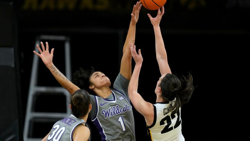 Kansas State guard Zyanna Walker (1) blocks a shot by Iowa guard Caitlin Clark (22) during the...